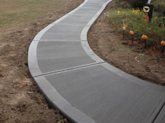 Sidewalk and Curb Paving Services That Prioritize Safety and Strength